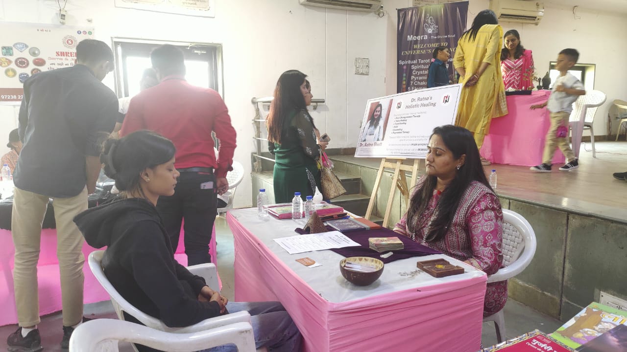 Dr. Ratna Bhatt offering healing at a wellness event